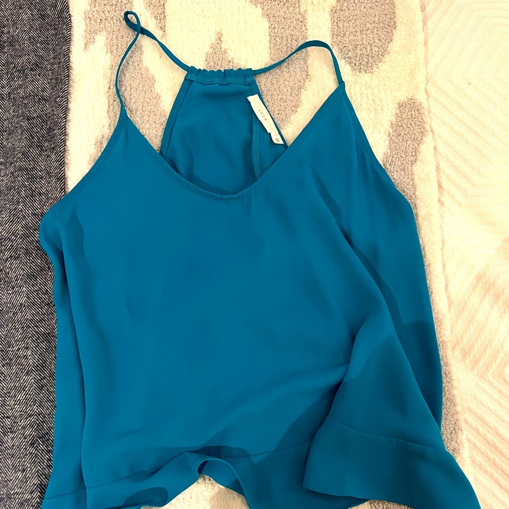 Adorable top to wear at night, flattering all over and cuts in on the back.